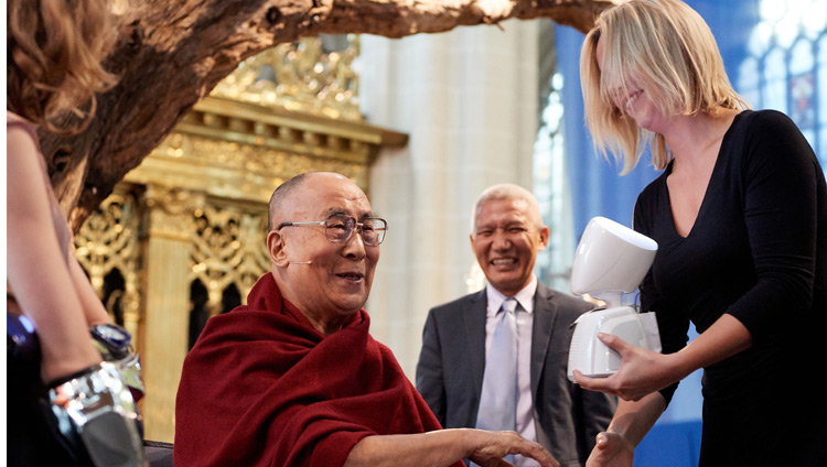 His Holiness the Dalai Lama interacting with AV1, the world’s first telepresence robot, during the discussion on ‘Robotics and Telepresence’ at the Nieuwe Kerk in Amsterdam, Netherlands on September 15, 2018. Photo by Olivier Adam