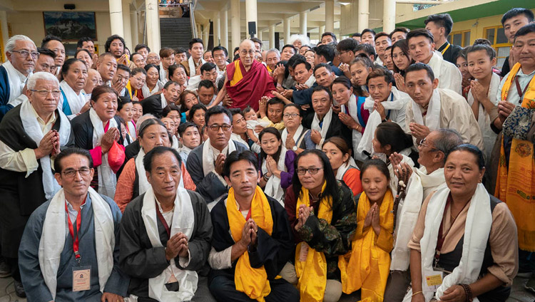 His Holiness the Dalai Lama posing for one of several group photos with Tibetans participating in an International Conference on the Middle Way Approach during their meeting at the Main Tibetan Temple courtyard in Dharamsala, HP, India on May 30, 2018. Photo by Tenzin Choejor