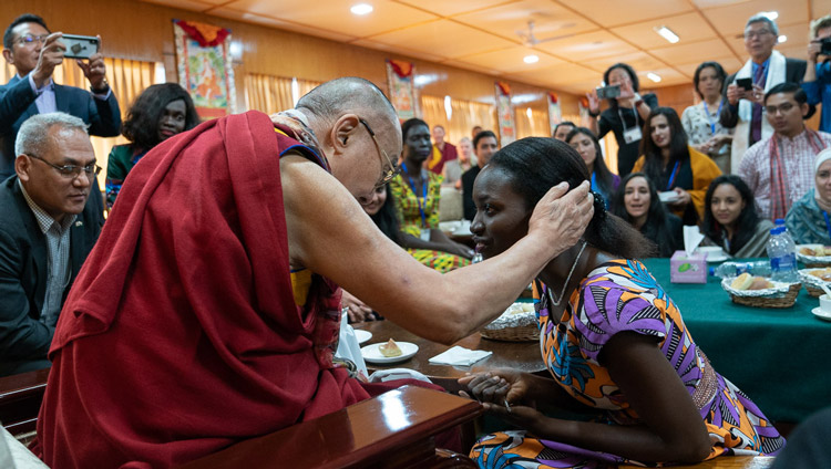 His Holiness the Dalai Lama thanking a young woman for participating in the conversation with young peacebuilders organized by the United States Institute of Peace at his residence in Dharamsala, HP, India on October 24, 2019. Photo by Tenzin Choejor