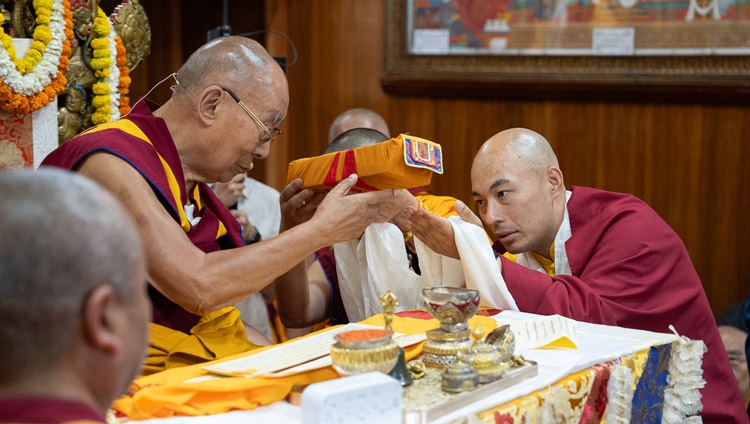 Kalu Rinpoché offering representations of body, speech and mind to His Holiness the Dalai Lama at the start of the Mahakala permission at the Main Tibetan Temple in Dharamsala, HP, India on May 18, 2024. Photo by Tenzin Choejor
