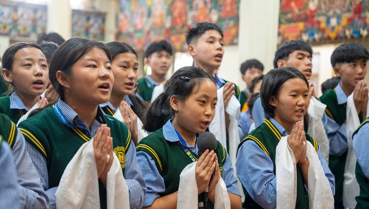 Children from Gopalpur TCV School reciting ‘A Clear Mirror: The Compendium of Awareness’ at the start of the first day of His Holiness the Dalai Lama's teachings for young Tibetans at the Main Tibetan Temple in Dharamsala, HP, India on June 3, 2024. Photo by Tenzin Choejor