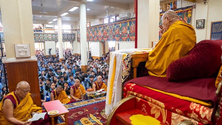 His Holiness the Dalai Lama reading from the text ‘Key to the Middle Way’, a book he composed himself, on the first day of teachings for young Tibetans at the Main Tibetan Temple in Dharamsala, HP, India on June 3, 2024. Photo by Tenzin Choejor