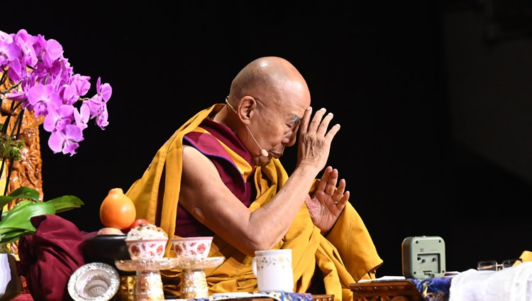 His Holiness the Dalai Lama reciting verses for generating the awakening mind during the Long Life Offering ceremony at the UBS Arena in Elmont, NY, USA on August 22, 2024. Photo by Sonam Zoksang