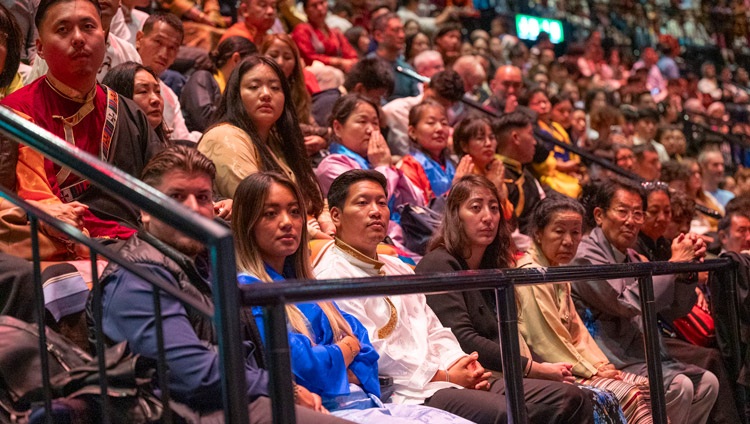 Members of the Tibetan community watching as His Holiness the Dalai Lama addresses the gathering at the Hallenstadion in Zurich, Switzerland on August 25, 2024. Photo by Manuel Bauer