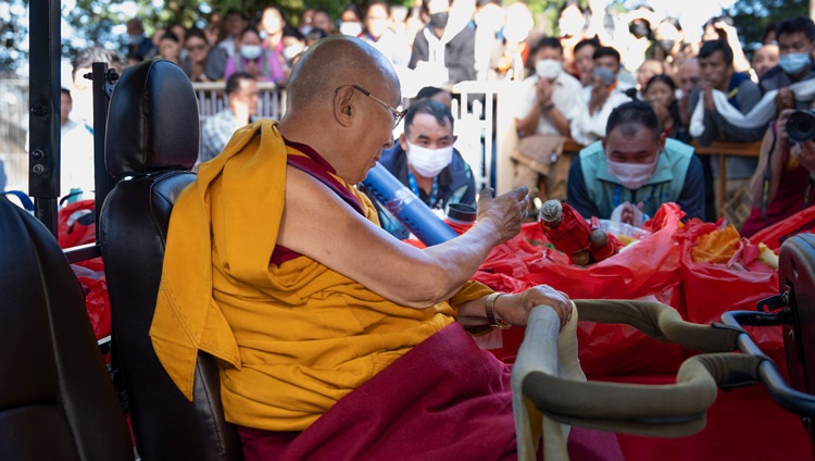 His Holiness the Dalai Lama riding a golf-cart from his residence to the Main Tibetan Temple to give his teaching for South-east Asian Buddhists in Dharamsala, HP, India on September 12, 2024. Photo by Tenzin Choejor