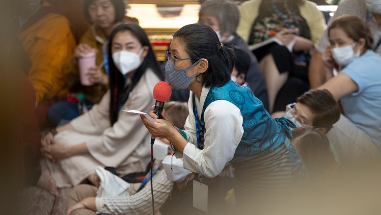 A member of the audience asking His Holiness the Dalai Lama a question during the teaching for South-east Asian Buddhists at the Main Tibetan Temple in Dharamsala, HP, India on September 12, 2024. Photo by Tenzin Choejor