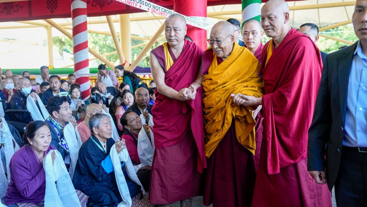 His Holiness the Dalai Lama engaging with members of the crowd as he walks to the Main Tibetan Temple to attend a Long Life Offering Ceremony in Dharamsala, HP, India on September 18, 2024. Photo by Tenzin Choejor