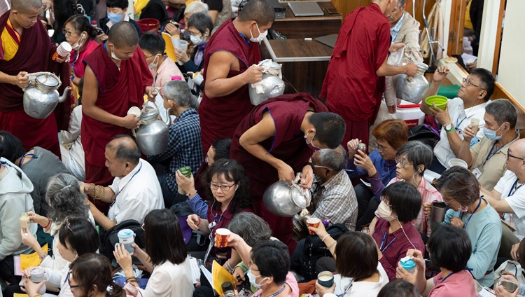 Tea and bread being served to the audience during a break in His Holiness the Dalai Lama's teaching at the Main Tibetan Temple in Dharamsala, HP, India on September 30, 2024. Photo by Tenzin Choejor