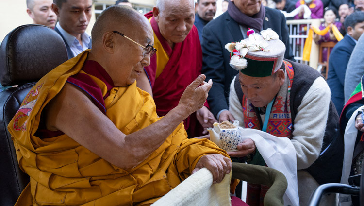 His Holiness the Dalai Lama receiving a traditional welcome as he arrives at the Main Tibetan Temple courtyard on his way to attend a Long Life Prayer offered by the people of Kinnaur in Dharamsala, HP, India on December 6, 2024. Photo by Ven Zamling Norbu