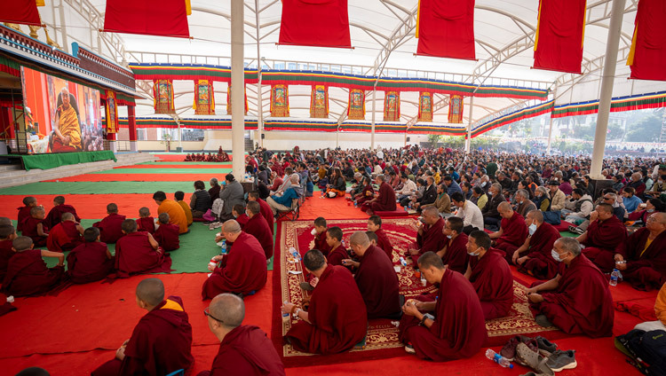 Members of the Tibetan community watching the proceedings of the prayers for victims of the recent earthquake in Tibet led by His Holiness the Dalai Lama on a big screen in the debate ground of Tashi Lhunpo Monastery in Bylakuppe, Karnataka, India on January 9, 2025. Photo by Ven Zamling Norbu