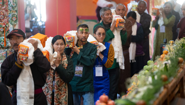 Members of the Tibetan community holding offerings for His Holiness the Dalai Lama during the Long Life Prayer Offering at Tashi Lhunpo Monastery in Bylakuppe, Karnataka, India on February 12, 2025. Photo by Tenzin Choejor