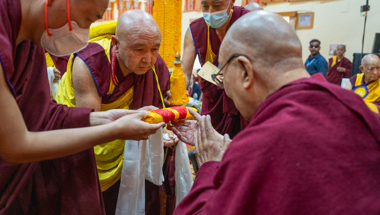 The Abbot of Gyumé Monastery, Geshé Ngawang Sangyé, offering a mandala to His Holiness the Dalai Lama during the welcome ceremony at Gyumé Tantric College in Hunsur, Karnataka, India on February 16, 2025. Photo by Tenzin Choejor