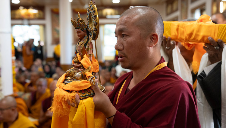 A member of the procession carrying offering for His Holiness the Dalai Lama during the Long Life Prayer offering at his old residence in Dharamsala, HP, India on March 24, 2025. Photo by Tenzin Choejor