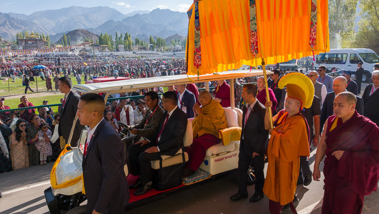 His Holiness the Dalai Lama riding in a golf cart from his residence to the pavilion at  Shewatsel Teaching Ground to attend a Long Life Offering Ceremony offered to him by the Ladakh Buddhist Association, the All Ladakh Gonpa Association and the Tibetan Community of Ladakh in Leh, Ladakh, India on August 30, 2026. Photo by Tenzin Choejor